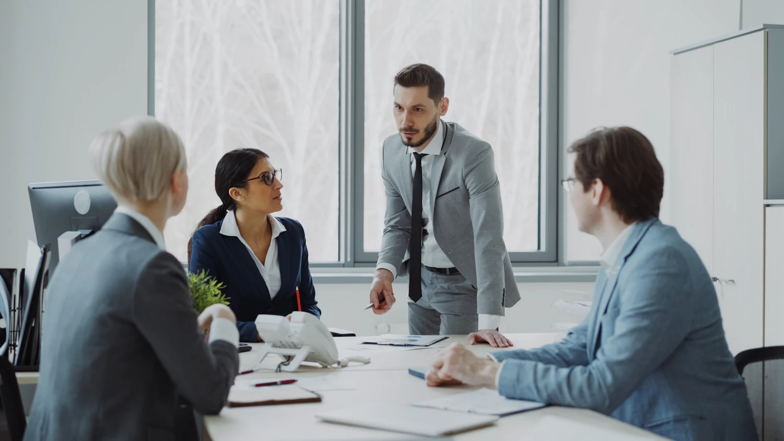 Business professionals meeting around a table